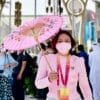 Levi Sap Nei Thang holding a pink Parasol with flowers