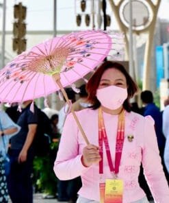 Levi Sap Nei Thang holding a pink Parasol with flowers